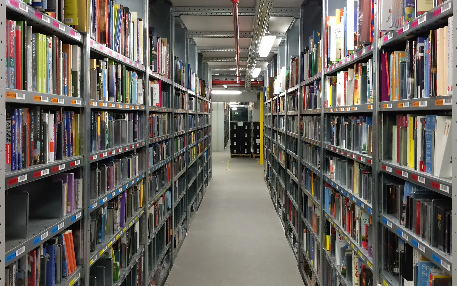 Interior of a vast distribution center with organized storage racks and logistics infrastructure